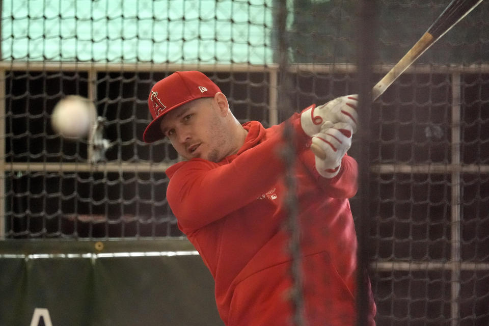 Los Angeles Angles' Mike Trout hits in the cages during a baseball spring training workout, Monday, Feb. 19, 2024, in Tempe, Ariz. (AP Photo/Matt York)