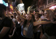 Supporters of Ekrem Imamoglu, the candidate of Turkey's secular opposition Republican People's Party, CHP, celebrate in central Istanbul, late Sunday, June 23, 2019. The opposition candidate for mayor of Istanbul celebrated a landmark win Sunday in a closely watched repeat election that ended weeks of political tension and broke the long hold President Recep Tayyip Erdogan's party had on leading Turkey's largest city. (AP Photo/Burhan Ozbilici)
