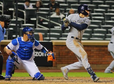 Apr 26, 2019; New York City, NY, USA; Milwaukee Brewers right fielder Christian Yelich (22) hits an RBI single against the New York Mets during the fifth inning at Citi Field. Mandatory Credit: Andy Marlin-USA TODAY Sports