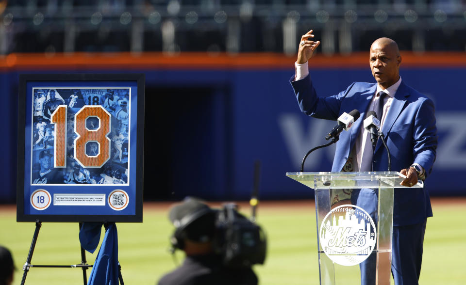 Former New York Mets outfielder Darryl Strawberry acknowledges fans during ceremony to retire his number at Citi Field, Saturday, June 1, 2024, in New York. (AP Photo/Noah K. Murray)