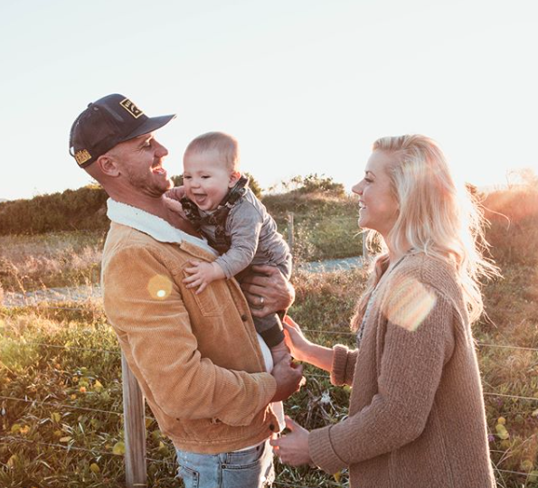 The couple posing with their adorable son Ziya. Source: Instagram/kyalandkara