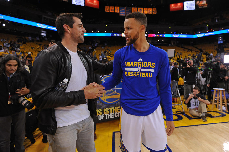 The guarantees on Aaron Rodgers’ contract are worth about half of what Stephen Curry is guaranteed to take home. (Getty Images)