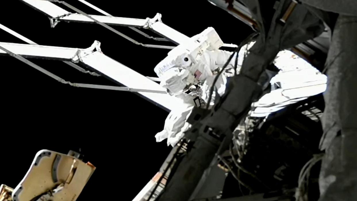 A NASA astronaut walks outside of the International Space Station during a rare all-female spacewalk.