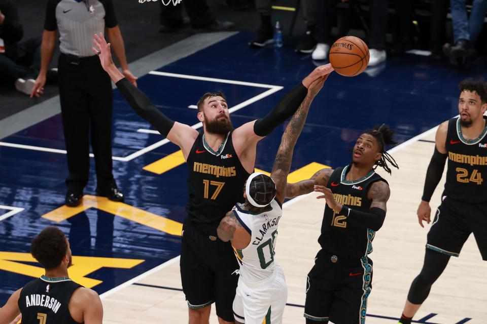 Memphis Grizzlies center Jonas Valanciunas blocks the shot of Utah Jazz guard Jordan Clarkson during the second quarter at Vivint Arena.