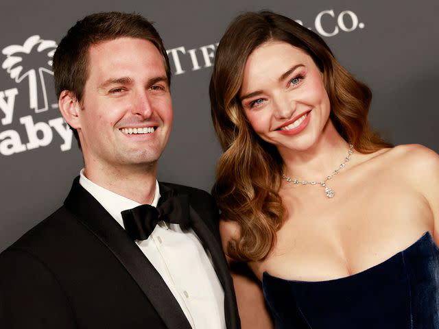 <p>MICHAEL TRAN/AFP/Getty</p> Evan Spiegel and Miranda Kerr at the 2022 Baby2Baby Gal in California.