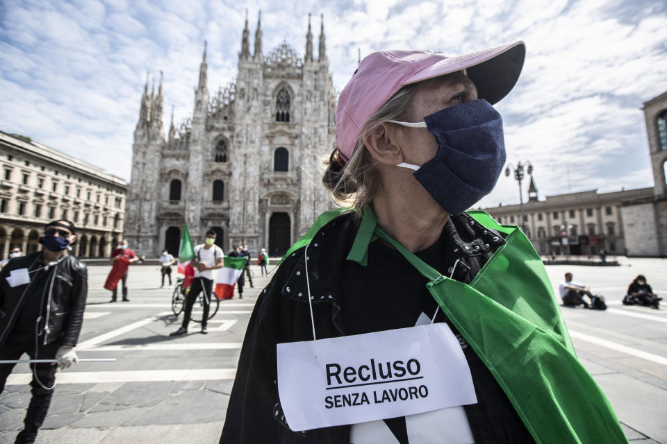 People stage a protest against the government in front of the Duomo in Milan, Italy.