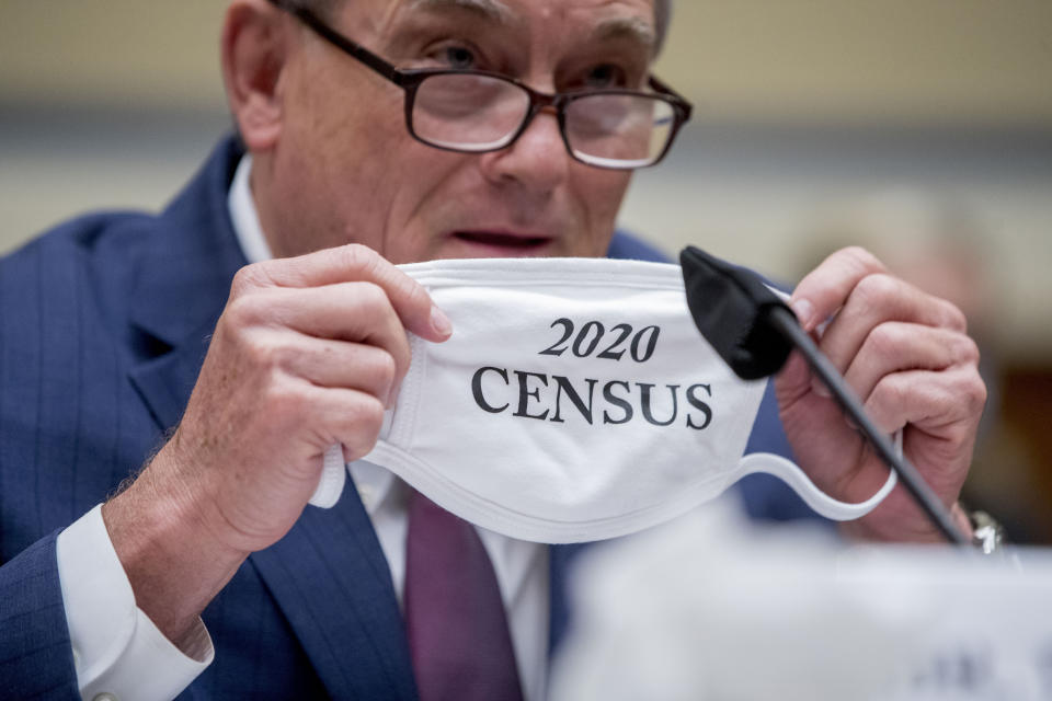 Census Bureau Director Steven Dillingham holds up his mask with the words "2020 Census" as he testifies before a House Committee on Oversight and Reform hearing on the 2020 Census​ on Capitol Hill, Wednesday, July 29, 2020, in Washington. (AP Photo/Andrew Harnik)