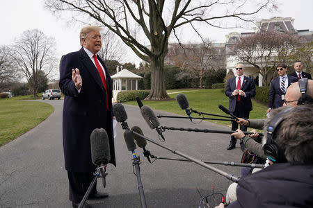 FILE PHOTO: U.S. President Donald Trump talks to reporters as he departs on travel to Ohio at the White House in Washington, U.S., March 20, 2019. REUTERS/Kevin Lamarque