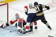 Florida Panthers' Sergei Bobrovsky (72) falls on the ice as Kevin Stenlund (82) defends against Boston Bruins' James van Riemsdyk (21) during the second period of an NHL hockey game, Saturday, April 6, 2024, in Boston. (AP Photo/Michael Dwyer)