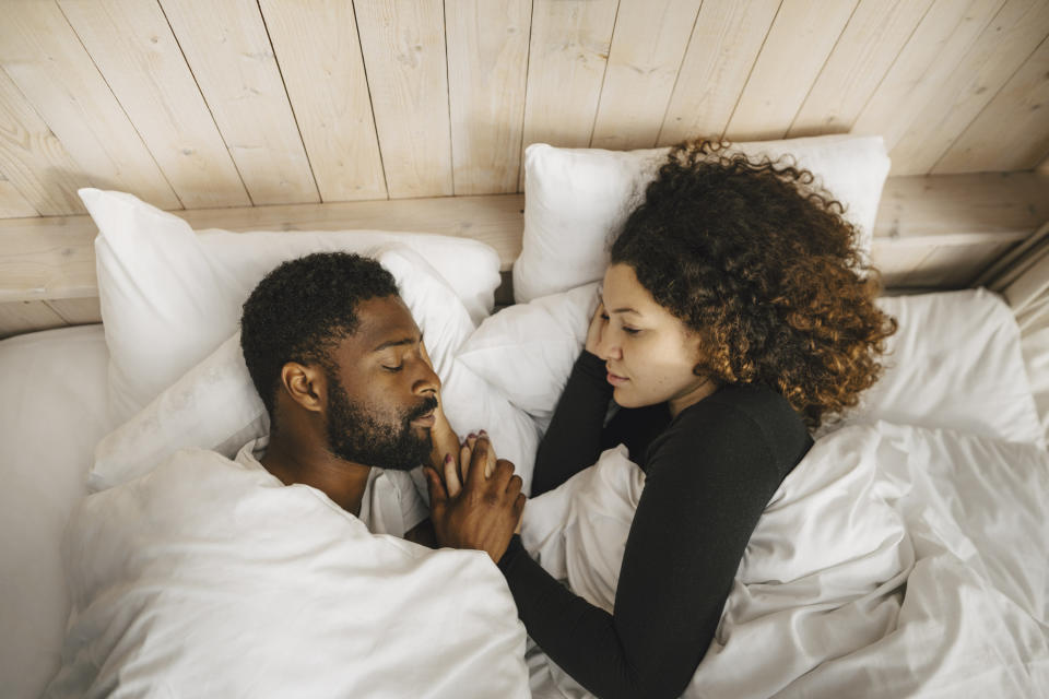 a couple lying in bed