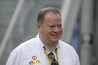 FILE - NASCAR car owner Chip Ganassi walks back to the garage area during a rain delay at the Coke Zero 400 auto race at Daytona International Speedway in Daytona Beach, Fla., in this Saturday, July 3, 2010, file photo. Chip Ganassi has sold his NASCAR team to Justin Marks, owner of Trackhouse Racing, and will pull out of the nation's top stock car series at the end of this season. Ganassi fields two cars in the Cup Series but will transfer his North Carolina race shop and all its assets to Marks for 2022. “He made me a great offer that required my attention,” Ganassi told The Associated Press on Wednesday, June 30, 3031, as the sale was announced. (AP Photo/Phelan M. Ebenhack, File)