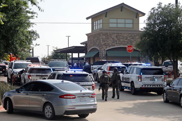 Emergency personnel work the scene of a shooting at the Allen Premium Outlets in Allen, Texas, on Saturday that left nine people dead, including the gunman.