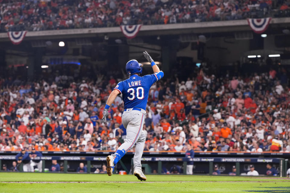 HOUSTON, TX - OCTOBER 23: Nathaniel Lowe #30 of the Texas Rangers celebrates while rounding the bases after hitting a two run home run against Bryan Abreu #52 of the Houston Astros during the sixth inning of Game Seven of the American League Championship Series at Minute Maid Park on October 23, 2023 in Houston, Texas. (Photo by Bailey Orr/Texas Rangers/Getty Images)