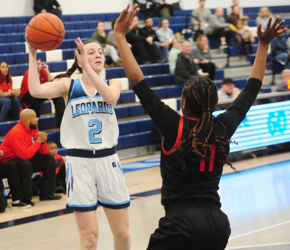 Louisville's Courtney Barwick looks to pass as Chaney's Alyssa Brown defends, Thursday Feb. 22, 2024.