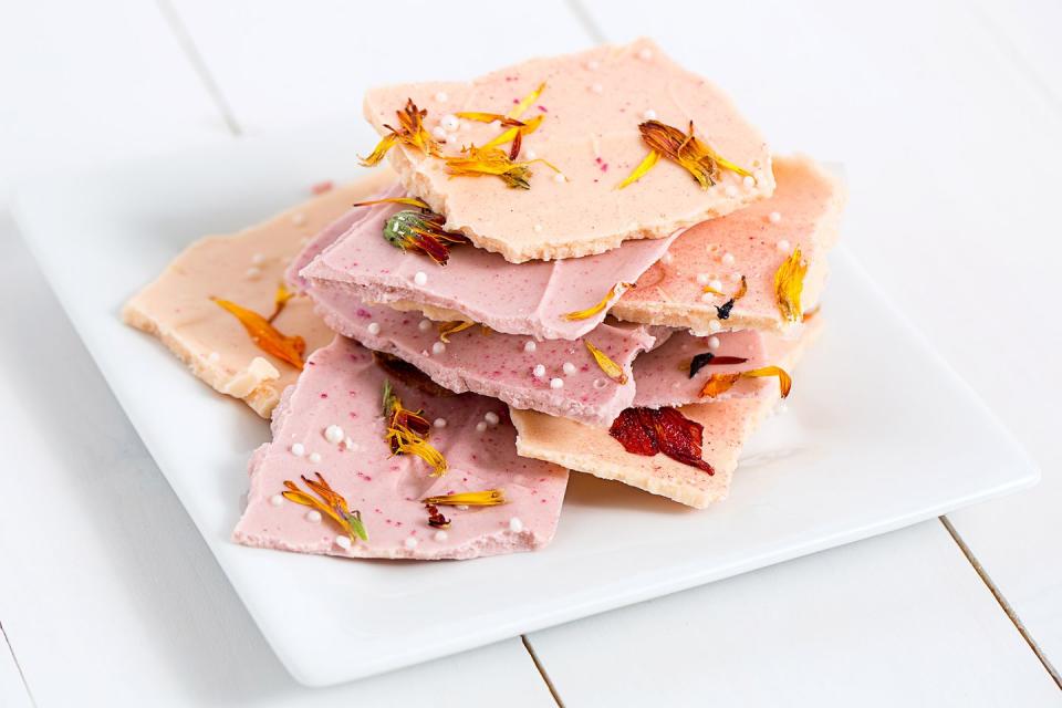 <p>Edible flowers and glitter, white chocolate pearls, and pastel-dyed white chocolate all make an appearance in this gorgeous bark. </p><p><em><a href="https://www.goodhousekeeping.com/holidays/mothers-day/a32159/mothers-day-chocolate-bark/" rel="nofollow noopener" target="_blank" data-ylk="slk:Get the recipe for Mother's Day Chocolate Bark »;elm:context_link;itc:0;sec:content-canvas" class="link ">Get the recipe for Mother's Day Chocolate Bark »</a></em> </p>