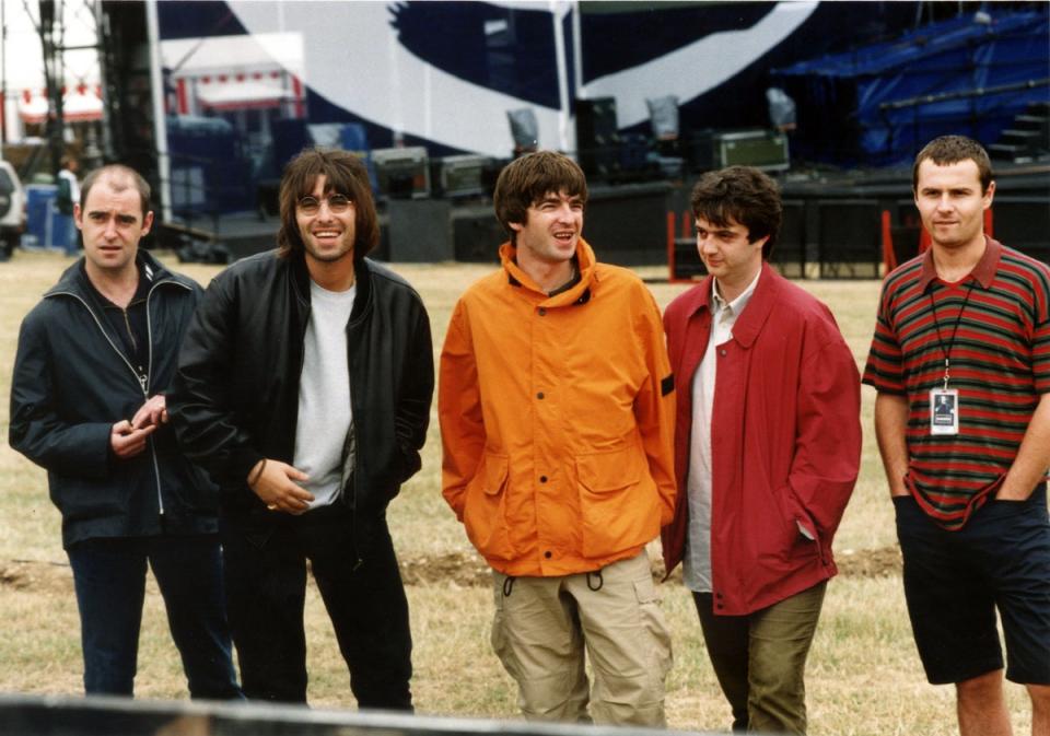 Gallagher, (centre) with Oasis bandmates, including brother Liam Gallagher (second from left) at their iconic Knebworth show in 1999, did his driving lesson at the peak of ‘Oasis-mania’ (PA)