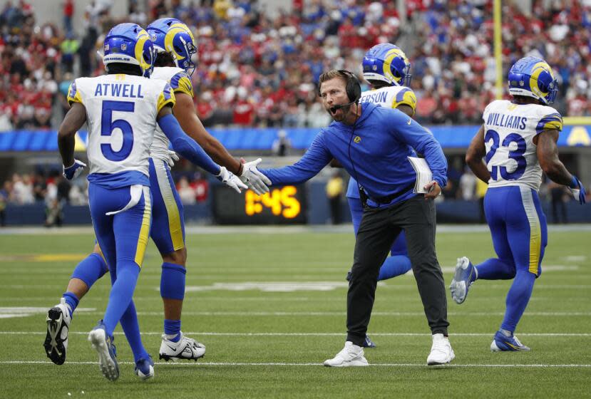 LOS ANGELES, CA - SEPTEMBER 17, 2023: Rams head coach Sean McVay congratulates Los Angeles Rams wide receiver Puka Nacua (17) and Los Angeles Rams wide receiver Tutu Atwell (5) after a touchdown against the San Francisco 49ers at SoFi Stadium on September 17, 2023 in Inglewood, California.(Gina Ferazzi / Los Angeles Times)