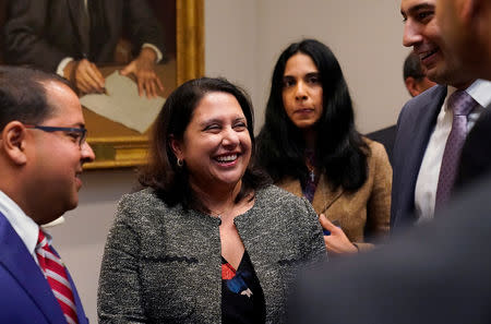 Neomi Rao (C), the administrator of the White House Office of Information and Regulatory Affairs, reacts after U.S. President Donald Trump announced that he is nominating her to replace Supreme Court Justice Brett Kavanaugh on the U.S. D.C. Circuit Court of Appeals during a Diwali ceremony at the White House in Washington, U.S. November 13, 2018. REUTERS/Jonathan Ernst