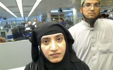 Syed Rizwan Farook (R) and Tashfeen Malik (L) arriving at O'Hare International Airport in Chicago, Illinois. The couple killed 14 people and and wounded 21 others in a shooting in San Bernardino, California,  - Credit: EPA