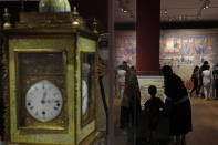 Visitors tour the Hong Kong Palace Museum during the first day open to public in Hong Kong, Sunday, July 3, 2022. It showcases more than 900 Chinese artefacts, loaned from the long-established Palace Museum in Beijing, home to works of art representing thousands of years of Chinese history and culture. (AP Photo/Kin Cheung)