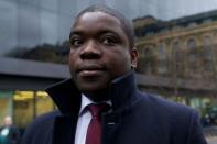 Former UBS banker Kweku Adoboli arrives at Southwark Crown Court in London. Adoboli, who gambled away $2.3 billion of the Swiss bank's money, was convicted of Britain's biggest ever fraud