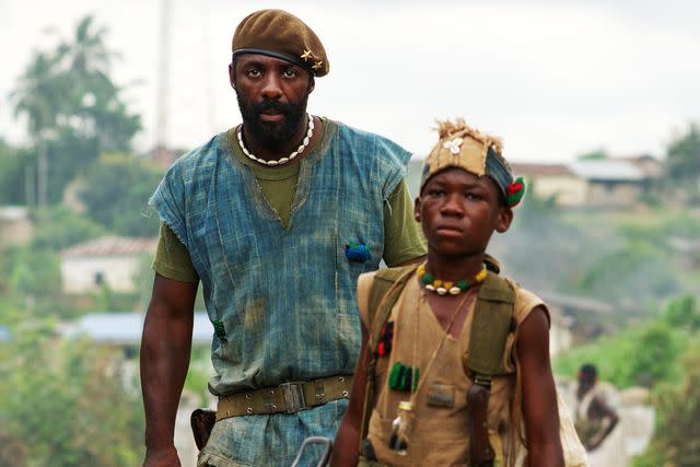 <p>Shawn Greene/Bleecker Street Media/ Everett</p> Idris Elba and Abraham Atta in 'Beasts of No Nation'