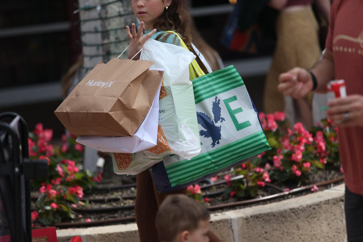 Shoppers looking for deals pack Miramar Outlets in Estero on Black Friday on Friday, Nov. 24, 2023.