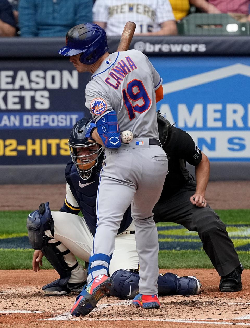 New York Mets left fielder Mark Canha (19) is hit by a pitch thrown by Milwaukee Brewers starting pitcher Adrian Houser during the fifth inning of their game Wednesday, September 21, 2022 at American Family Field in Milwaukee, Wis.