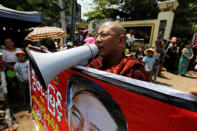 Buddhist activist monk Parmaukkha shouts as newly released prisoners, part of over 8,000 inmates granted amnesty by Myanmar's President Win Myint to mark Myanmar's new year, walk out from Insein prison in Yangon, Myanmar April 17, 2018. REUTERS/Ann Wang