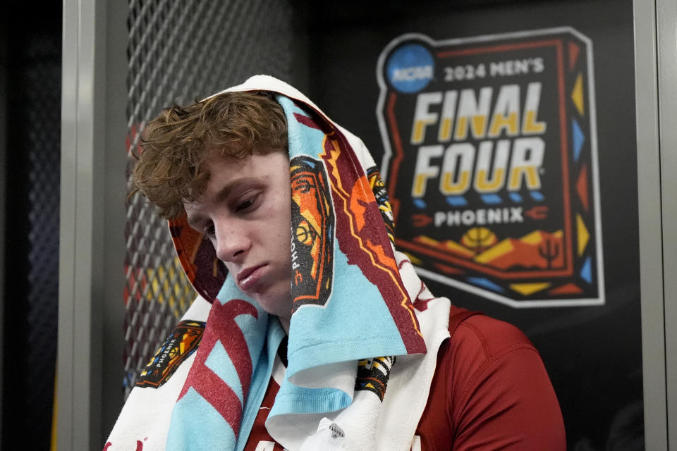 Alabama forward Sam Walters (24) sits in the locker room after their loss against UConn in a NCAA college basketball game at the Final Four, Saturday, April 6, 2024, in Glendale, Ariz. (AP Photo/David J. Phillip)