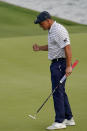 Bryson DeChambeau celebrates after a putt on the 18th hole during the third round of The Players Championship golf tournament Saturday, March 13, 2021, in Ponte Vedra Beach, Fla. (AP Photo/John Raoux)