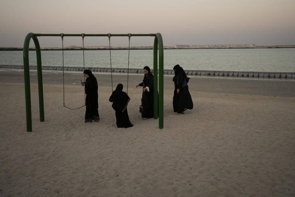 Women visit a beach during the World Cup soccer tournament, in Jor, Qatar, Sunday, Nov. 27, 2022. (AP Photo/Moises Castillo)