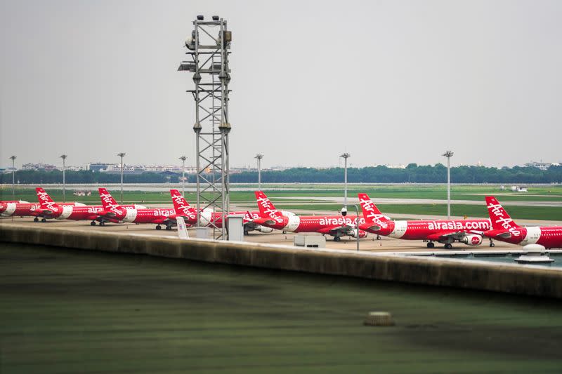 Thai AirAsia aircraft are seen on the tarmac at Don Mueang International Airport in Bangkok