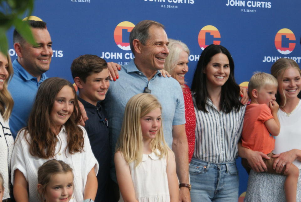  Utah Republican Rep. John Curtis poses with his family at a primary election watch party in Provo on Tuesday, June 25, 2024. The Associated Press has called the Utah primary race for U.S. Senate for Curtis. (Nathan Beitler for Utah News Dispatch)