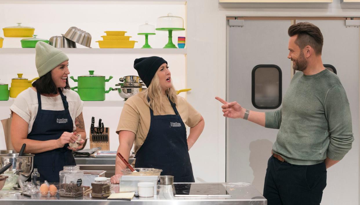 Contestants Hannah Reyes and Kathleen Regelman, owners of Kreger's Bakery and Cup & Cake in Wausau, with host Joel McHale in the “Not So Simple” episode of "Crime Scene Kitchen," which aired on Fox.