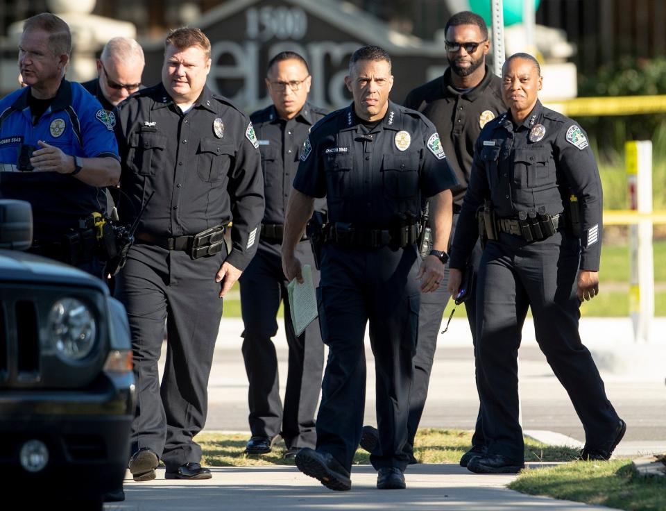 Then-Austin Police Chief Joe Chacon, third from right, is joined by other officers May 26 at the scene of a deadly police shooting in Southeast Austin. A pilot program will change the process for some people after they are arrested.