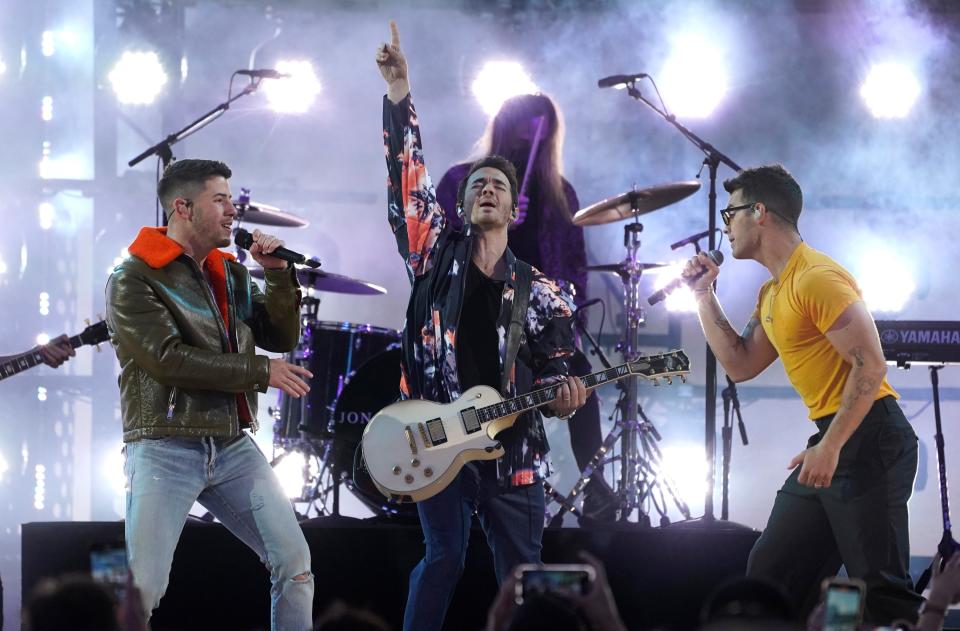 Nick Jonas, from left, Kevin Jonas and Joe Jonas, of the Jonas Brothers, perform.