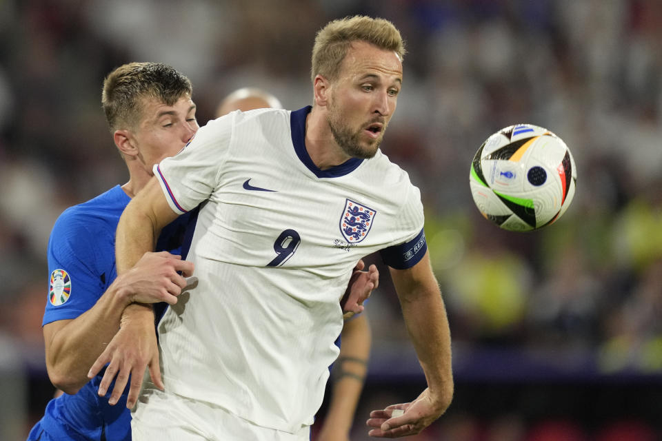 England's Harry Kane challenges for the ball with Slovenia's Jaka Bijol during a Group C match between the England and Slovenia at the Euro 2024 soccer tournament in Cologne, Germany, Tuesday, June 25, 2024. (AP Photo/Andreea Alexandru)