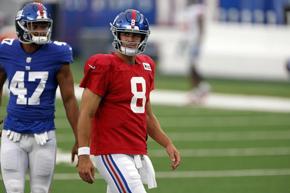 New York Giants quarterback Daniel Jones (8) looks on prior to a scrimmage at the NFL football team's training camp in East Rutherford, N.J., Friday, Aug. 28, 2020. (AP Photo/Adam Hunger)