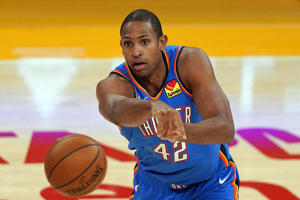 FILE - In this Feb. 8, 2021, file photo, Oklahoma City Thunder center Al Horford passes the ball during the second half of an NBA basketball game against the Los Angeles Lakers in Los Angeles. The Boston Celtics traded point guard Kemba Walker to Oklahoma City for Al Horford, a person with knowledge of the deal told The Associated Press on Friday, June 18, 2021. (AP Photo/Mark J. Terrill, File)