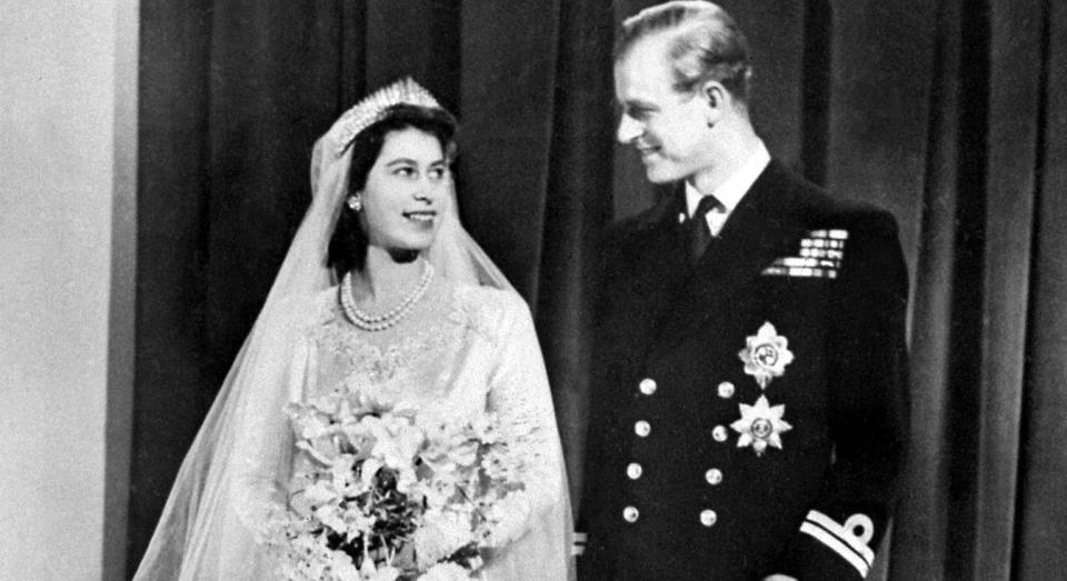 Britain's Princess Elizabeth (future Queen Elizabeth II) (L) and Philip, Duke of Edinburgh (R) pose on their wedding day at Buckingham Palace in London on November 20, 1947. (Photo by - / - / AFP) (Photo by -/-/AFP via Getty Images)