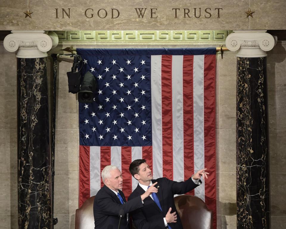 US Vice President Mike Pence (L) confers wirh Speaker of the House Paul Ryan (R) prior to US President Donald Trump's address before a joint session of the US Congress on February 28, 2017 at the Capitol in Washington, DC.&nbsp;