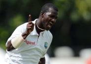 West Indies cricket team captain Darren Sammy celebrates dismissing Australian batsman David Warner during the final day of the first-of-three Test matches between Australia and West Indies at the Kensington Oval stadium in Bridgetown on April 11, 2012. Australia is chasing a target of 192 runs to win the match. AFP PHOTO/Jewel Samad (Photo credit should read JEWEL SAMAD/AFP/Getty Images)