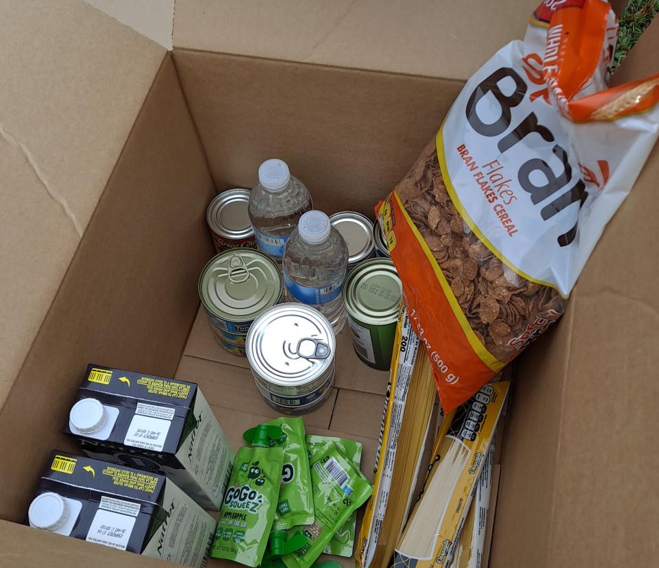 An crisis food kit that was distributed recently. Pasta, bran flakes, and shelf-stable milk are a few of the items. (Karen Wall/Patch)