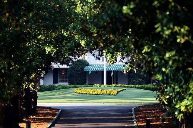 Augusta National Golf Club, seen down Magnolia Lane, is well manicured on what would have been the first practice round for the Masters golf tournament Monday in Augusta, Ga. The 2020 Masters, postponed because of the coronavirus pandemic, is slated to take place on Nov. 12-15.