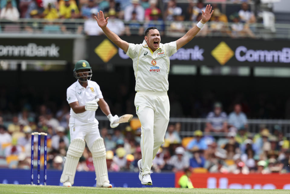 Australia's Scott Boland appeals unsuccessfully for the wicket of South Africa's Khaya Zondo during day two of the first cricket test between South Africa and Australia at the Gabba in Brisbane, Australia, Sunday, Dec.18, 2022. (AP Photo/Tertius Pickard)