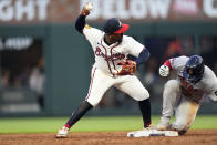Atlanta Braves second base Ozzie Albies (1) forces out Boston Red Sox' Connor Wong (12) on a ground ball from Tyler O'Neill in the third inning of a baseball game Wednesday, May 8, 2024, in Atlanta. (AP Photo/John Bazemore)
