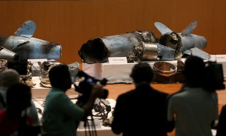 Remains of the missiles which were used to attack an Aramco oil facility, are displayed during a news conference in Riyadh