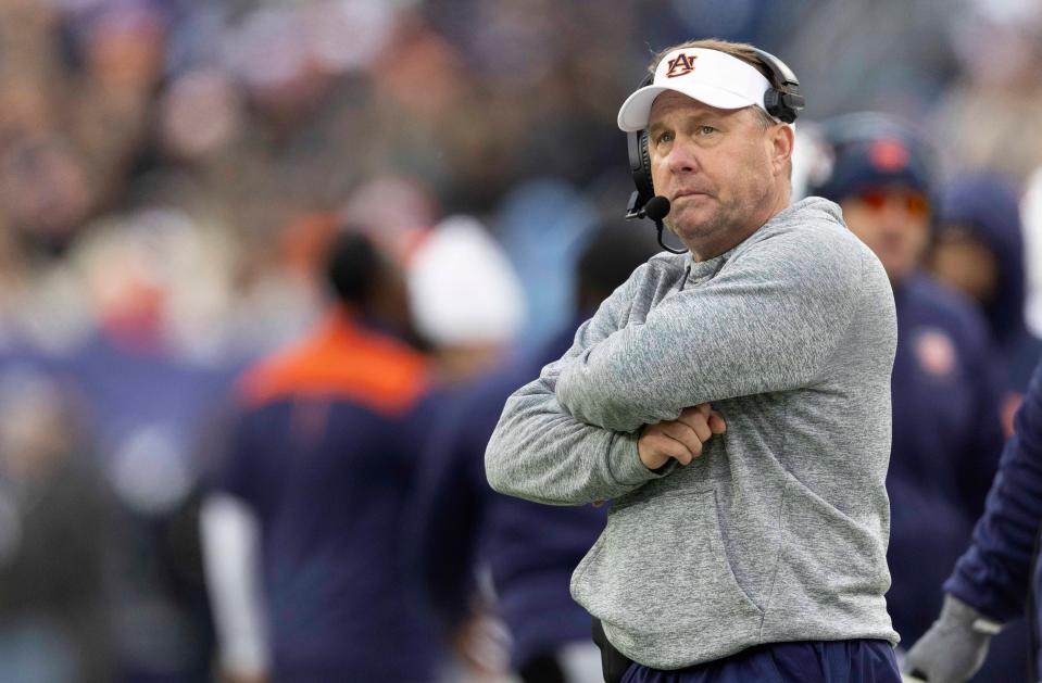 Dec 30, 2023; Nashville, Tennessee, United States; Auburn head coach Hugh Freeze watches play on the Jumbotron during the TransPerfect Music City Bowl against Maryland at Nissan Stadium. Mandatory Credit: Wade Payne-The Tennessean