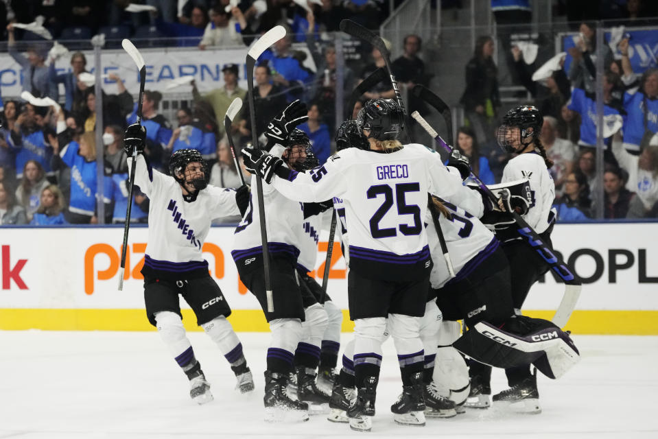 Minnesota players celebrate after defeating Toronto in Game 5 of a PWHL playoff hockey series Friday, May 17, 2024, in Toronto. (Frank Gunn/The Canadian Press via AP)